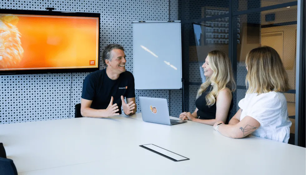 Insource IT team meeting with clients in a boardroom
