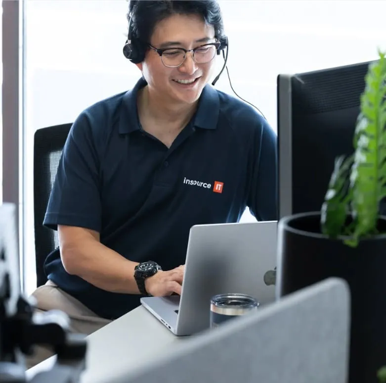 Insource IT engineer on a headset